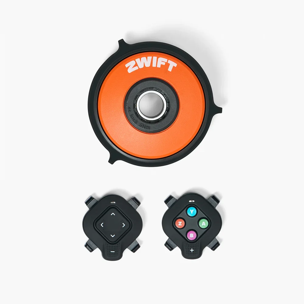 Zwift Cog and Click upgrade kit showing the orange Cog disc and two Click shifters